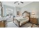 Cozy bedroom with window seat, decorative dresser, and ornate bed frame at 2102 E Norwood St, Mesa, AZ 85213