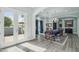 Airy dining room with bright light, modern wood flooring, and classic chandelier lighting at 2102 E Norwood St, Mesa, AZ 85213