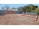 Exterior view showing the gravel side yard, and a brick-lined planting area at 2102 E Norwood St, Mesa, AZ 85213