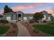 Well-maintained single-story home featuring desert landscaping, a tiled roof, and neutral exterior paint at 2102 E Norwood St, Mesa, AZ 85213