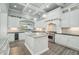 Bright kitchen featuring marble countertops, custom cabinetry, and stainless steel appliances at 2102 E Norwood St, Mesa, AZ 85213