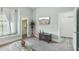 Inviting living room featuring tiled floors, built-in shelving, and comfortable seating at 2102 E Norwood St, Mesa, AZ 85213