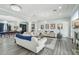 Elegant living room with stylish decor, a fireplace, and seamless flow into the dining area at 2102 E Norwood St, Mesa, AZ 85213