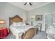 Main bedroom with ornate bed frame, chandelier, and nearby walk-in closet at 2102 E Norwood St, Mesa, AZ 85213