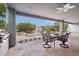 Outdoor covered patio with grill and ample seating overlooking the swimming pool at 2102 E Norwood St, Mesa, AZ 85213