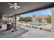 Covered patio area with seating and a view of the outdoor pool area, ideal for relaxation at 2102 E Norwood St, Mesa, AZ 85213