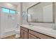 A stylish bathroom showcases subway tile in the shower and a vanity with quartz countertops at 21036 E Stacey Rd, Queen Creek, AZ 85142