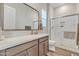 Modern bathroom features a glass shower, and a stylish vanity with quartz countertops at 21036 E Stacey Rd, Queen Creek, AZ 85142