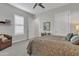 Inviting bedroom featuring a ceiling fan, comfy chair, and large bed with patterned bedding at 21036 E Stacey Rd, Queen Creek, AZ 85142