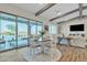 Bright dining area with a round table, views of the pool, and access to outdoor living at 21036 E Stacey Rd, Queen Creek, AZ 85142