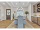 Formal dining room with an elegant chandelier, a rug, and a view of the front door at 21036 E Stacey Rd, Queen Creek, AZ 85142