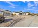 Exterior shot of new homes, each with a 2-car garage and drought resistant landscaping at 21036 E Stacey Rd, Queen Creek, AZ 85142