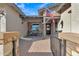 Charming home featuring a quaint front porch seating area, enhanced by an American flag and stylish stone accents at 21036 E Stacey Rd, Queen Creek, AZ 85142