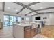 Well-designed kitchen island with stainless steel farmhouse sink, and nearby dining and living spaces at 21036 E Stacey Rd, Queen Creek, AZ 85142