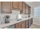 Modern kitchenette with stainless steel appliances, sleek countertops, and custom cabinetry at 21036 E Stacey Rd, Queen Creek, AZ 85142