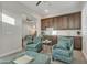 Lounge area featuring kitchenette, ceiling fan, and comfortable patterned seating arrangement at 21036 E Stacey Rd, Queen Creek, AZ 85142