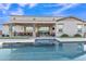 Stunning pool view from the backyard featuring a covered patio and outdoor seating, ideal for entertaining at 21036 E Stacey Rd, Queen Creek, AZ 85142