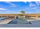 Inviting backyard swimming pool with a decorative water feature and desert landscaping under blue skies at 21036 E Stacey Rd, Queen Creek, AZ 85142