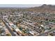 A neighborhood is displayed from above, highlighting a pool, solar panels, and mountain views at 2212 E Hillery Dr, Phoenix, AZ 85022