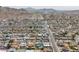 Expansive aerial view of a neighborhood, showcasing the community's layout, streets, and surrounding landscape at 2212 E Hillery Dr, Phoenix, AZ 85022