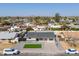 Aerial view of a single-Gathering home, landscaping and with mountain views in the distance at 2212 E Hillery Dr, Phoenix, AZ 85022