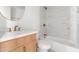 Bright bathroom featuring marble tile, modern vanity, and brushed gold fixtures at 2212 E Hillery Dr, Phoenix, AZ 85022