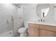 Modern bathroom featuring a glass shower and vanity with marble countertop at 2212 E Hillery Dr, Phoenix, AZ 85022