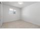 Neutral bedroom with tile floors, white paint, and a closet with a sliding door at 2212 E Hillery Dr, Phoenix, AZ 85022