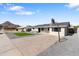 Charming single-story home with neat landscaping and a basketball hoop on the driveway at 2212 E Hillery Dr, Phoenix, AZ 85022