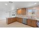 Open concept kitchen featuring stainless steel appliances and custom cabinetry at 2212 E Hillery Dr, Phoenix, AZ 85022