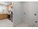 Well-equipped kitchen area with stainless steel appliances and connections for washer/dryer at 2212 E Hillery Dr, Phoenix, AZ 85022