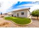 Charming backyard featuring a putting green, patio, and a sparkling pool for outdoor entertainment at 2348 W Flint St, Chandler, AZ 85224