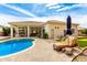 Outdoor space featuring a pool, patio, and mature greenery with a beautiful blue sky above at 2348 W Flint St, Chandler, AZ 85224