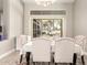 Bright dining room with large window and decorative chandelier at 2348 W Flint St, Chandler, AZ 85224