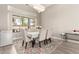 Formal dining room with large window and decorative chandelier at 2348 W Flint St, Chandler, AZ 85224