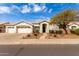 Charming single-story home with well-manicured landscaping and attached two-car garage at 2348 W Flint St, Chandler, AZ 85224