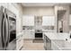 Well-lit kitchen features stainless steel appliances and designer backsplash at 2348 W Flint St, Chandler, AZ 85224