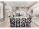 Open kitchen showcasing a large island with seating and modern pendant lighting at 2348 W Flint St, Chandler, AZ 85224