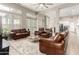 Open-concept living room with wood floors adjacent to kitchen at 2348 W Flint St, Chandler, AZ 85224