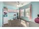 Bright, airy bedroom featuring pink and blue accents, with a loft bed and desk setup at 2562 E Oxford Ct, Gilbert, AZ 85295