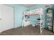 Bright, airy bedroom featuring pink and blue accents, with a loft bed and desk setup at 2562 E Oxford Ct, Gilbert, AZ 85295