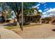 Charming two-story home featuring a two-car garage and a welcoming covered porch with seating area at 2562 E Oxford Ct, Gilbert, AZ 85295