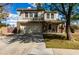 Charming two-story home featuring a two-car garage and a welcoming covered porch with seating area at 2562 E Oxford Ct, Gilbert, AZ 85295