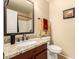 Bathroom boasts granite countertops, a stylish sink, and a mirror, creating a clean and functional space at 2708 E Desert Rose Trl, San Tan Valley, AZ 85143