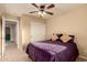 Bedroom with neutral carpet, a ceiling fan, and a closet at 2708 E Desert Rose Trl, San Tan Valley, AZ 85143