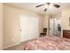 Comfortable bedroom featuring neutral walls, carpet flooring, and a closet with sliding doors at 2708 E Desert Rose Trl, San Tan Valley, AZ 85143