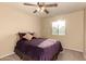 Well lit bedroom with neutral carpet, a ceiling fan, and a window at 2708 E Desert Rose Trl, San Tan Valley, AZ 85143