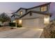 Lovely two-story home featuring manicured landscaping, a spacious driveway, and an attached two-car garage at 2708 E Desert Rose Trl, San Tan Valley, AZ 85143