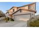 Lovely two-story home featuring manicured landscaping, a spacious driveway, and an attached two-car garage at 2708 E Desert Rose Trl, San Tan Valley, AZ 85143