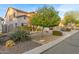 Charming home with desert landscaping, including mature trees and drought-tolerant plants at 2708 E Desert Rose Trl, San Tan Valley, AZ 85143